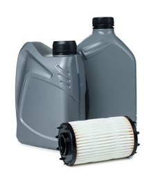 Photo of Motor oil in plastic canisters and filter isolated on white