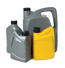 Photo of Motor oil in plastic canisters isolated on white