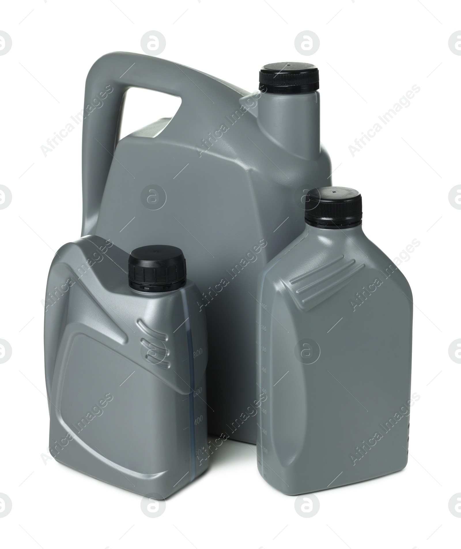 Motor oil in plastic canisters isolated on white Photo of Motor oil in plastic canisters isolated on white