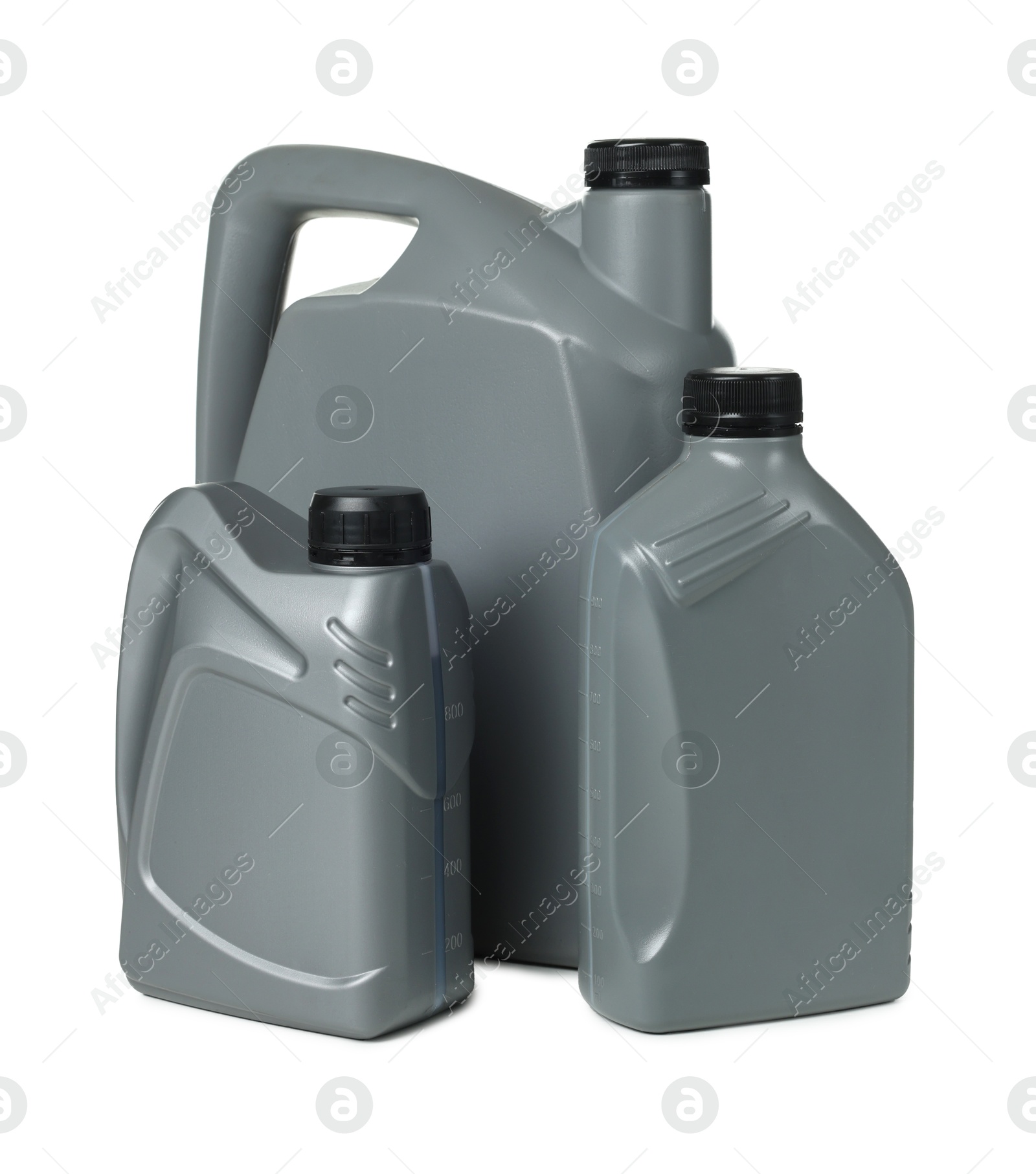 Motor oil in plastic canisters isolated on white Photo of Motor oil in plastic canisters isolated on white