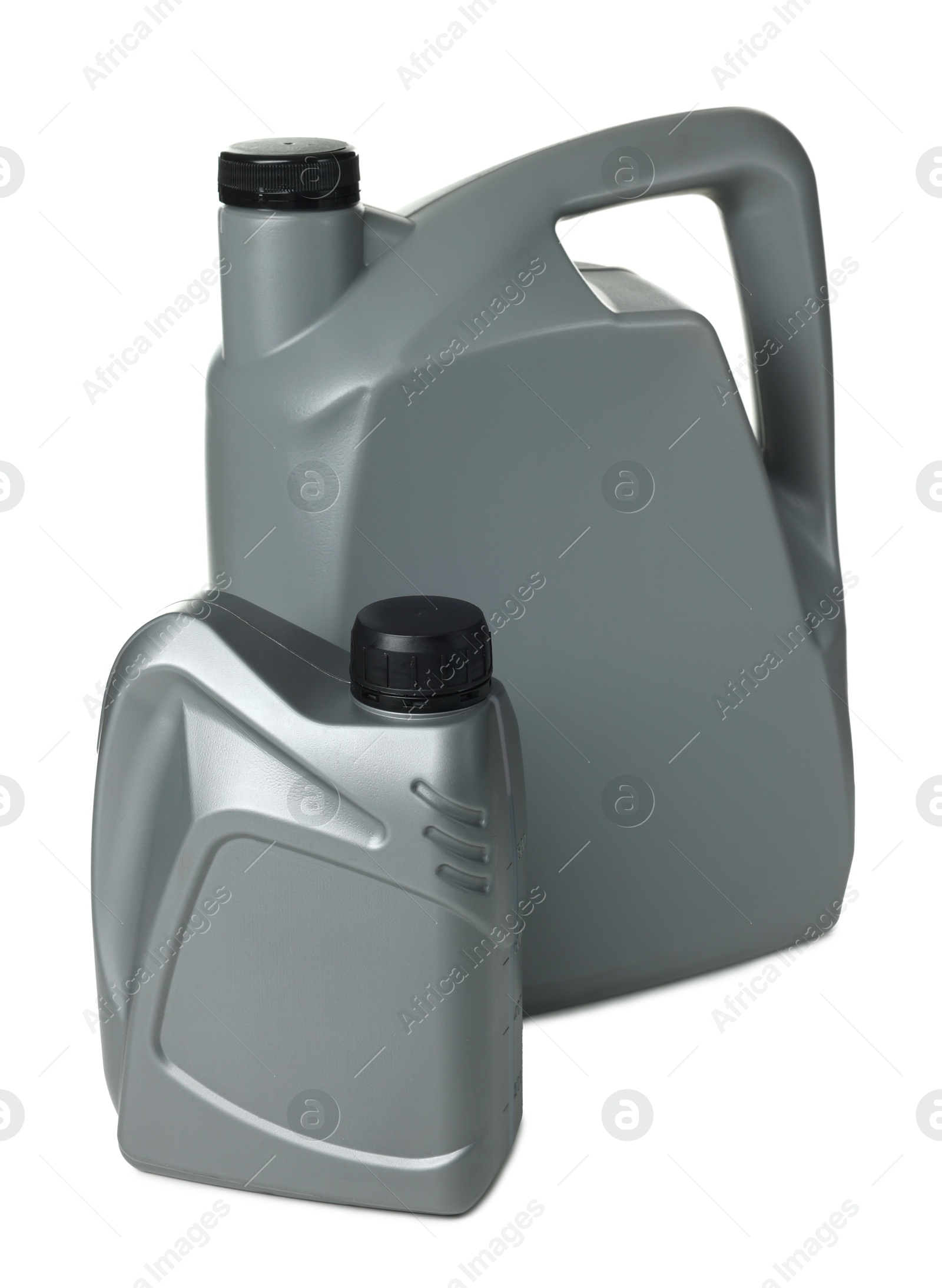 Motor oil in plastic canisters isolated on white Photo of Motor oil in plastic canisters isolated on white