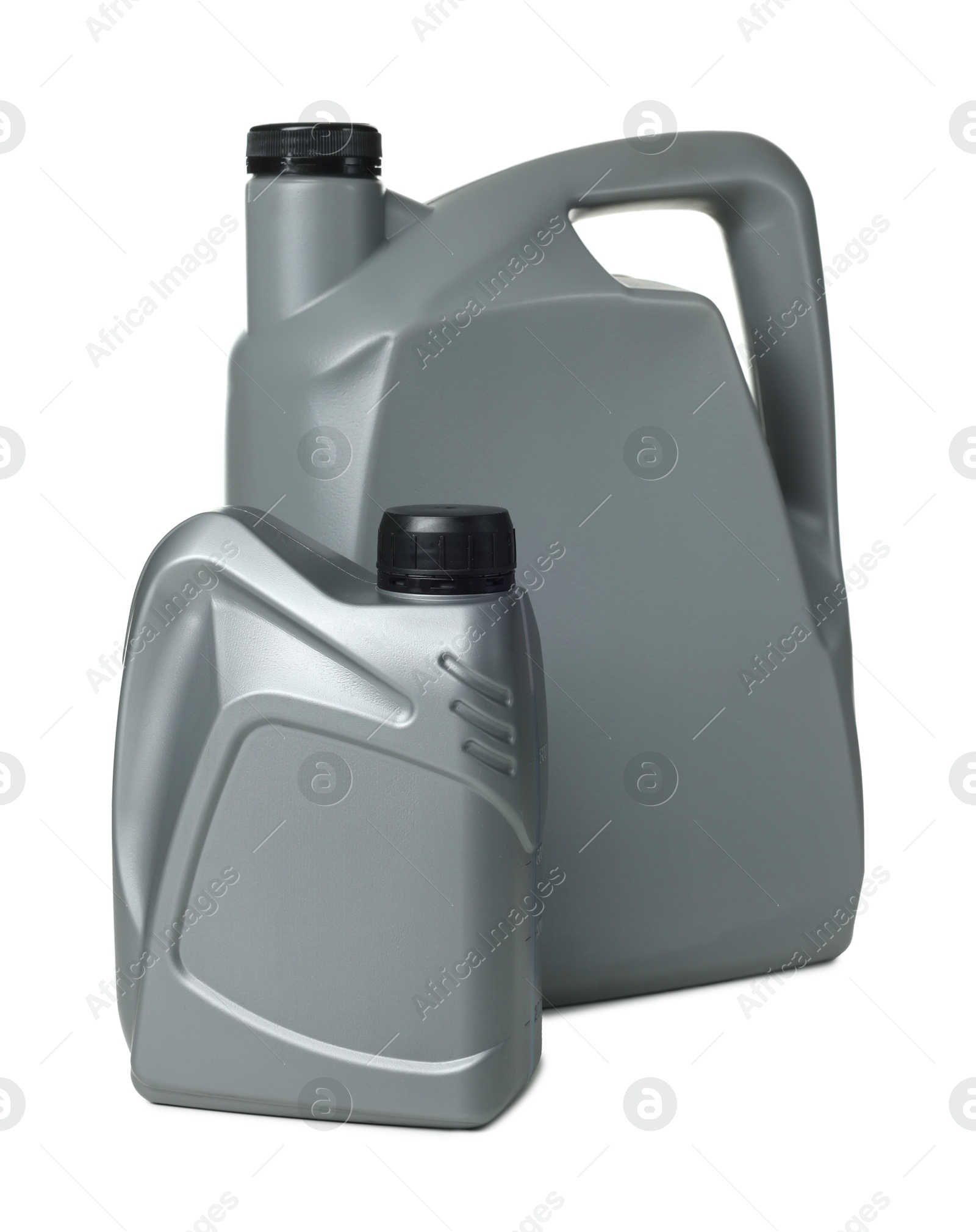 Motor oil in plastic canisters isolated on white Photo of Motor oil in plastic canisters isolated on white