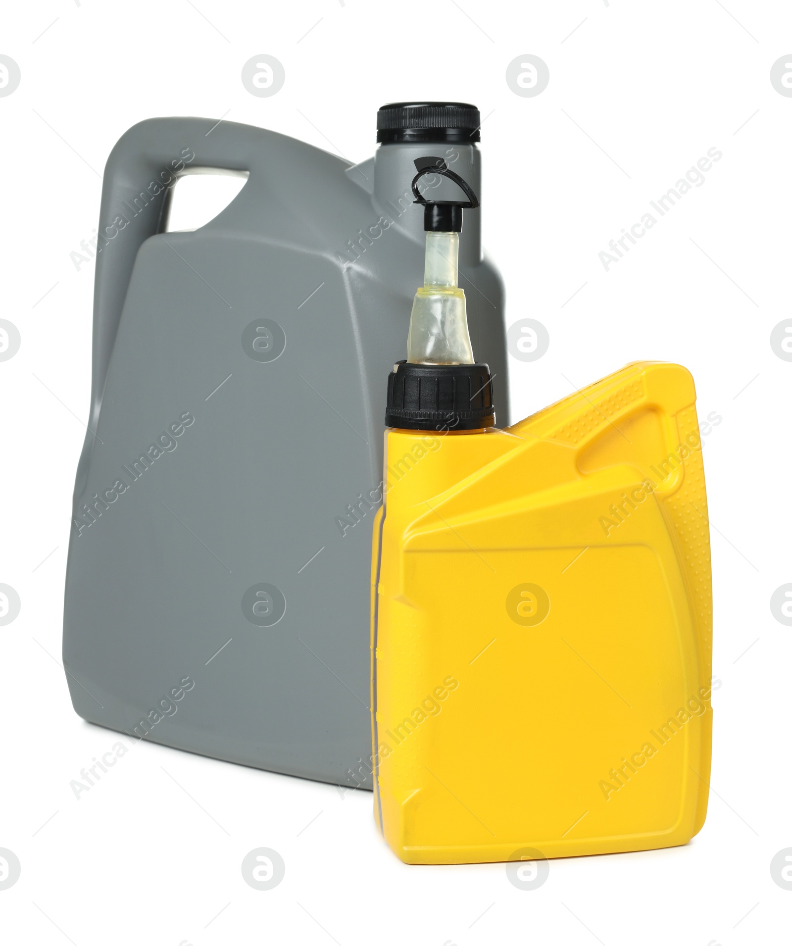Motor oil in plastic canisters isolated on white Photo of Motor oil in plastic canisters isolated on white