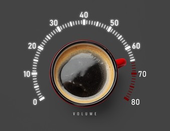 Image of Coffee and volume of energy gauge scale on grey background, top view. Handle of cup pointing at maximum area. Stimulating property of caffeine