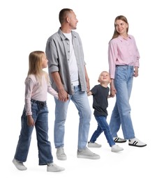 Photo of Happy family holding hands while walking on white background