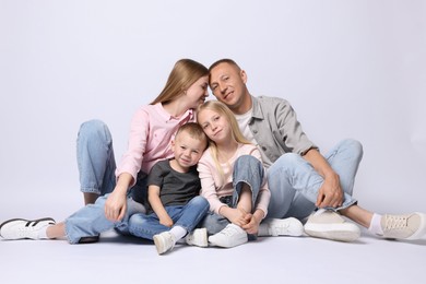 Photo of Full length portrait of happy family on light grey background