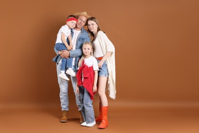 Photo of Happy family on light brown background. Space for text