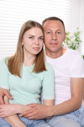 Photo of Portrait of cute lovely couple at home