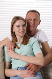 Photo of Portrait of happy lovely couple at home