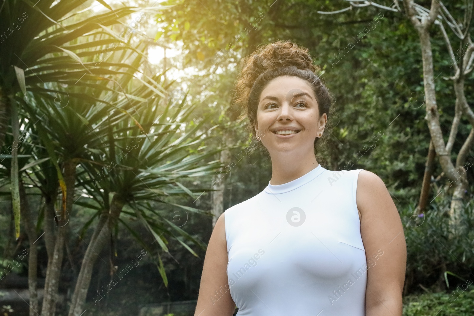 Happy woman in tropical forest, space text copy Photo of Happy woman in tropical forest, space text copy