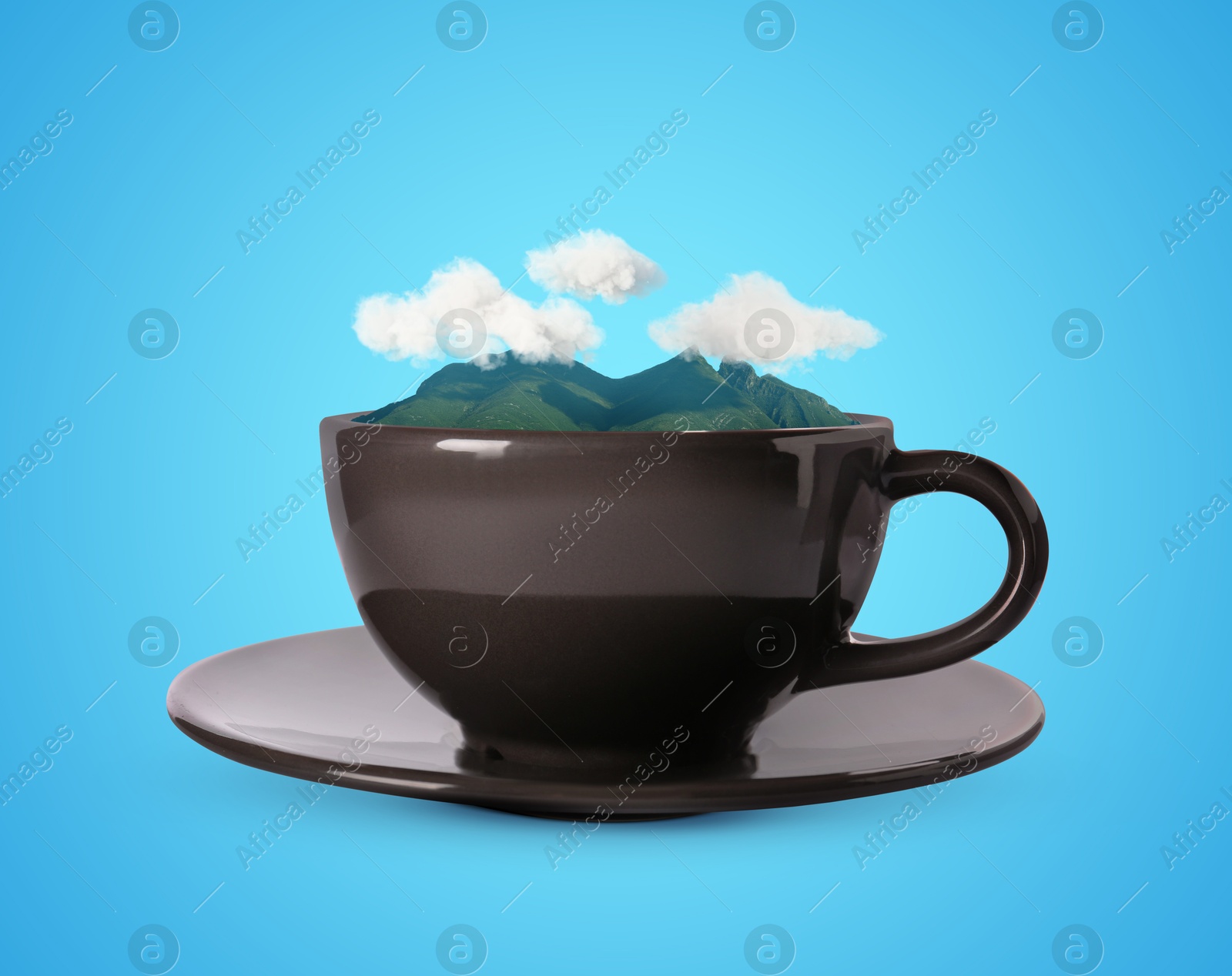 Image of Clouds above mountains in cup against light blue background