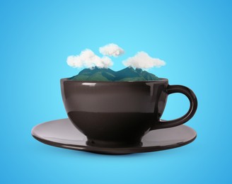 Image of Clouds above mountains in cup against light blue background