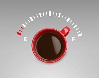 Image of Coffee and fuel gauge scale on grey gradient background, top view. Handle of cup pointing at Full area. Energizing property of caffeine