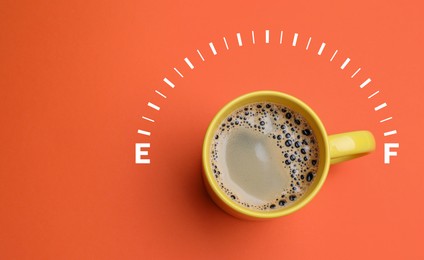 Image of Coffee and fuel gauge scale on coral background, top view. Handle of cup pointing at Full mark. Energizing property of caffeine