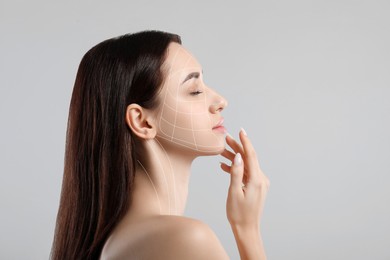 Image of Beautiful woman with perfect skin after collagen treatment on grey background, space for text. Lines on her face illustrating lifting and smoothing effect