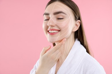 Image of Beautiful woman with perfect skin after collagen treatment on pink background. Lines on her face illustrating lifting and smoothing effect
