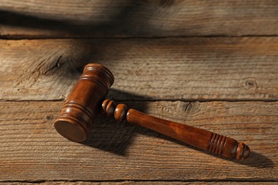 Photo of Judge's gavel on wooden table, above view