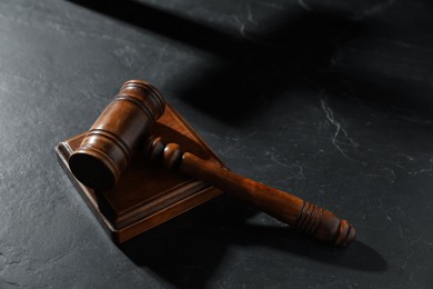 Photo of Judge's gavel on black table, above view