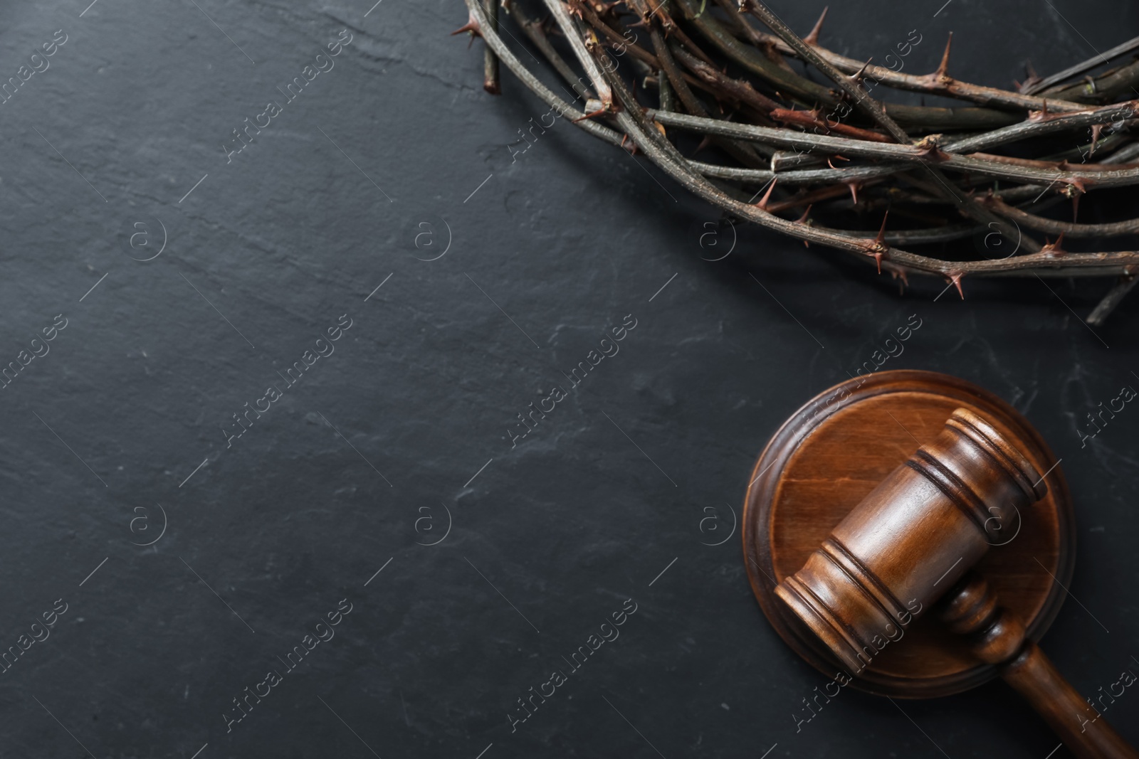 Judge's gavel and crown of thorns on black table, flat lay. Space for text Photo of Judge's gavel and crown of thorns on black table, flat lay. Space for text