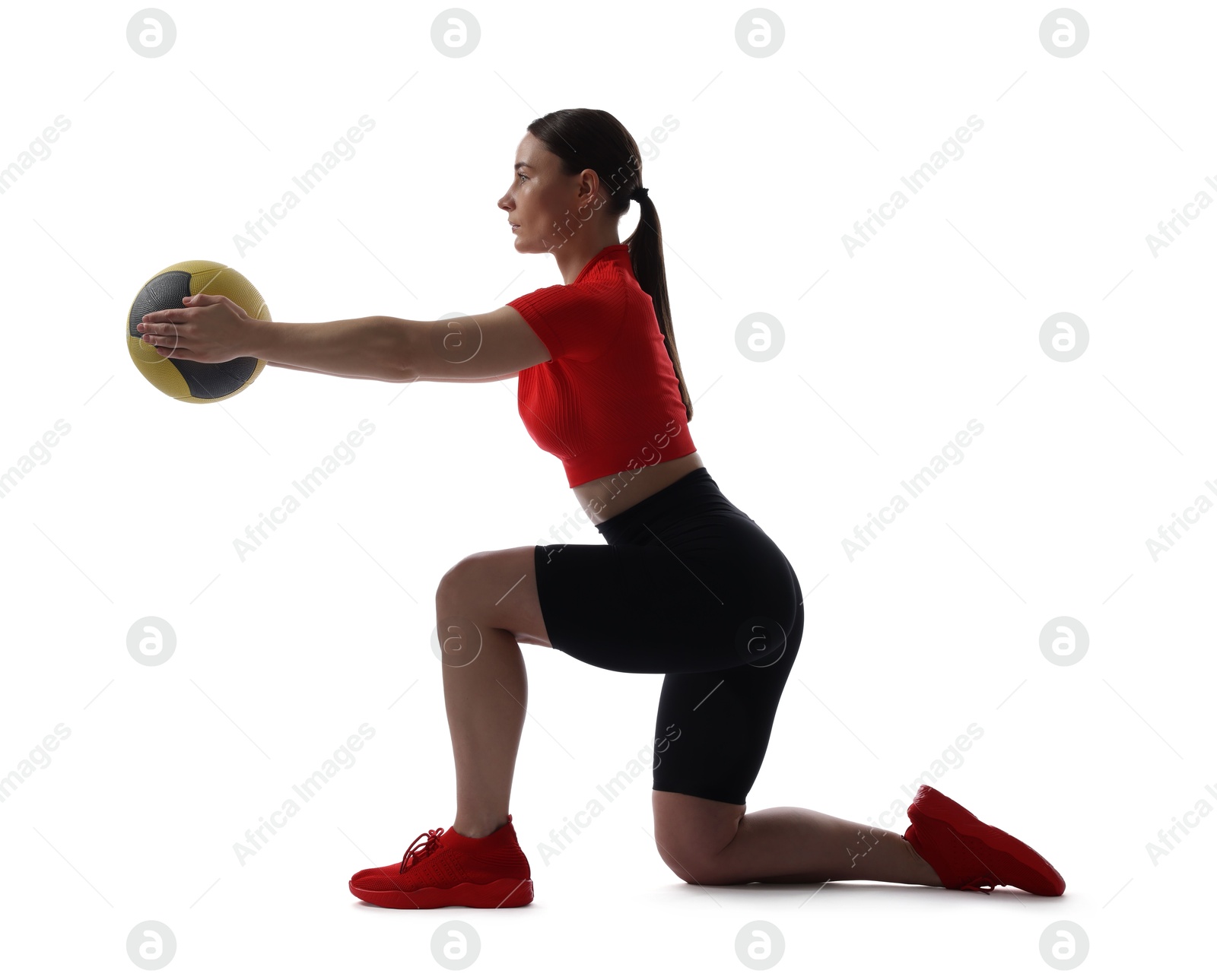 Athletic woman exercising with medicine ball on white background Photo of Athletic woman exercising with medicine ball on white background