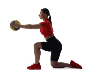 Photo of Athletic woman exercising with medicine ball on white background