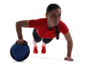 Photo of Athletic woman exercising with medicine ball on white background