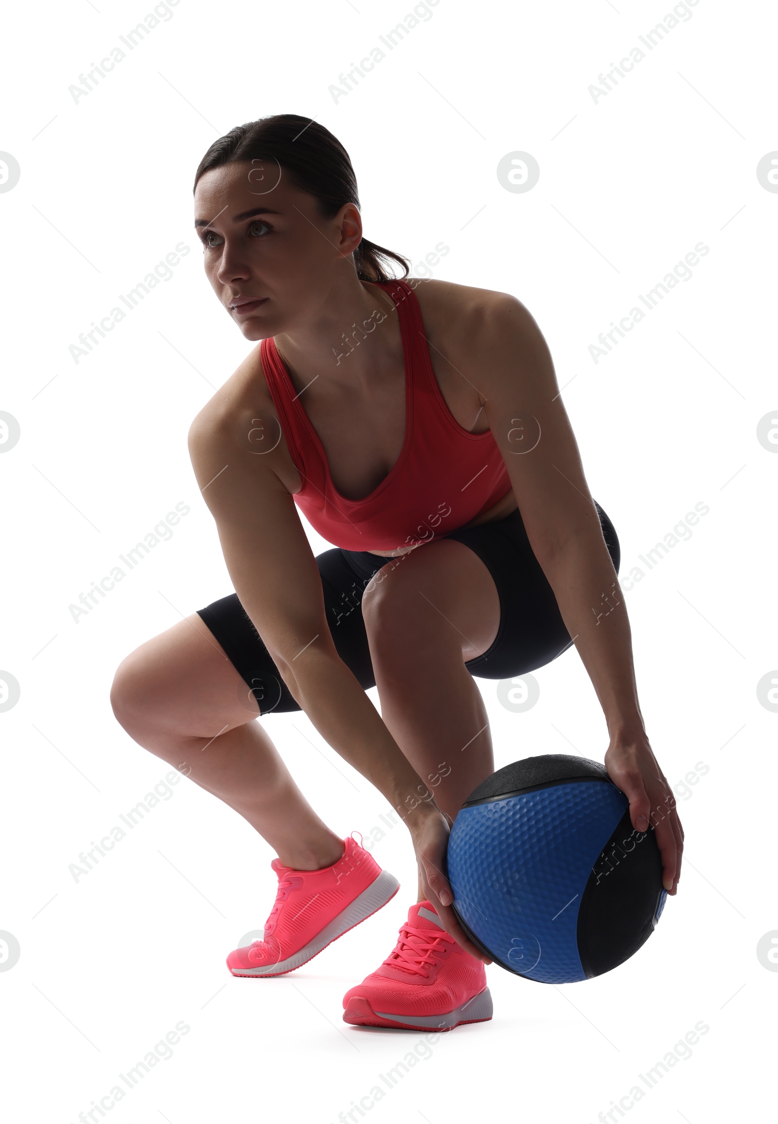 Athletic woman exercising with medicine ball on white background Photo of Athletic woman exercising with medicine ball on white background