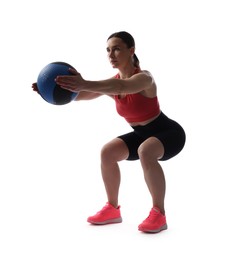 Photo of Athletic woman exercising with medicine ball on white background