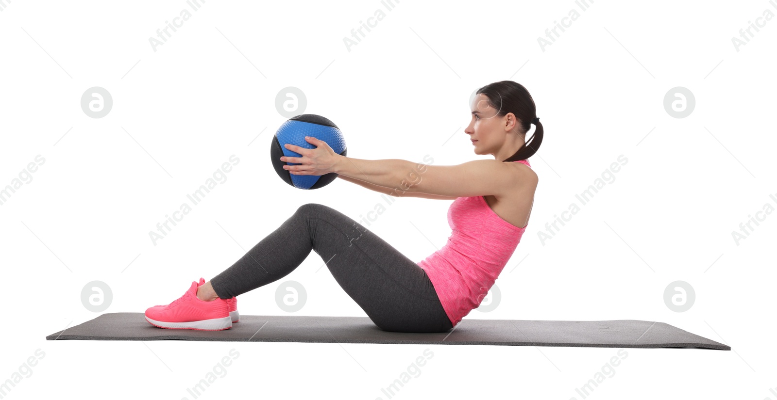 Athletic woman exercising with medicine ball on white background Photo of Athletic woman exercising with medicine ball on white background