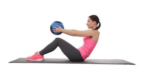 Photo of Athletic woman exercising with medicine ball on white background