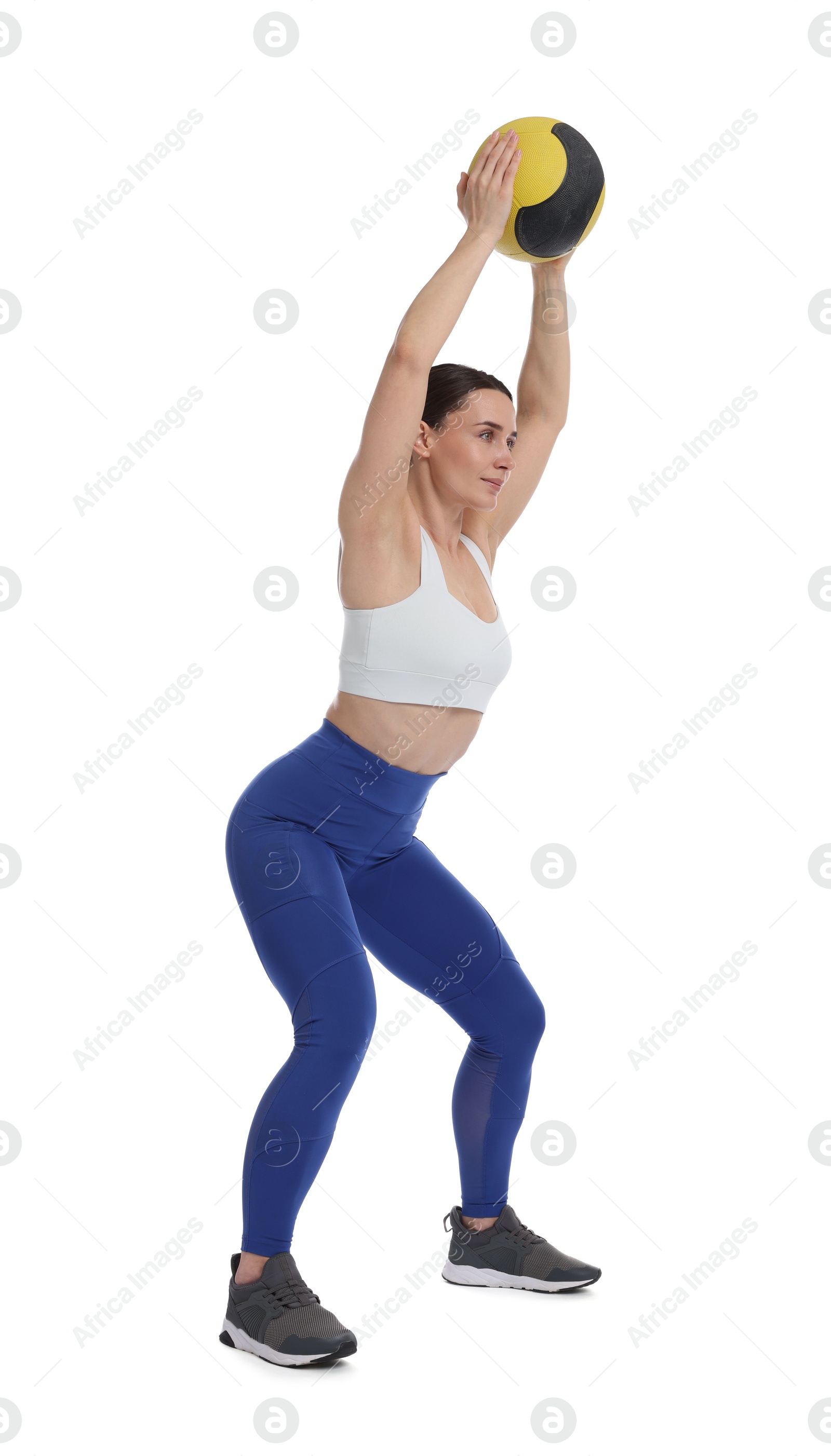 Athletic woman exercising with medicine ball on white background Photo of Athletic woman exercising with medicine ball on white background
