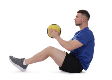 Photo of Man exercising with medicine ball on white background