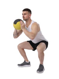 Photo of Man exercising with medicine ball on white background