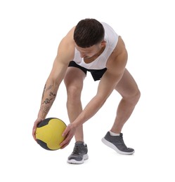 Photo of Man exercising with medicine ball on white background