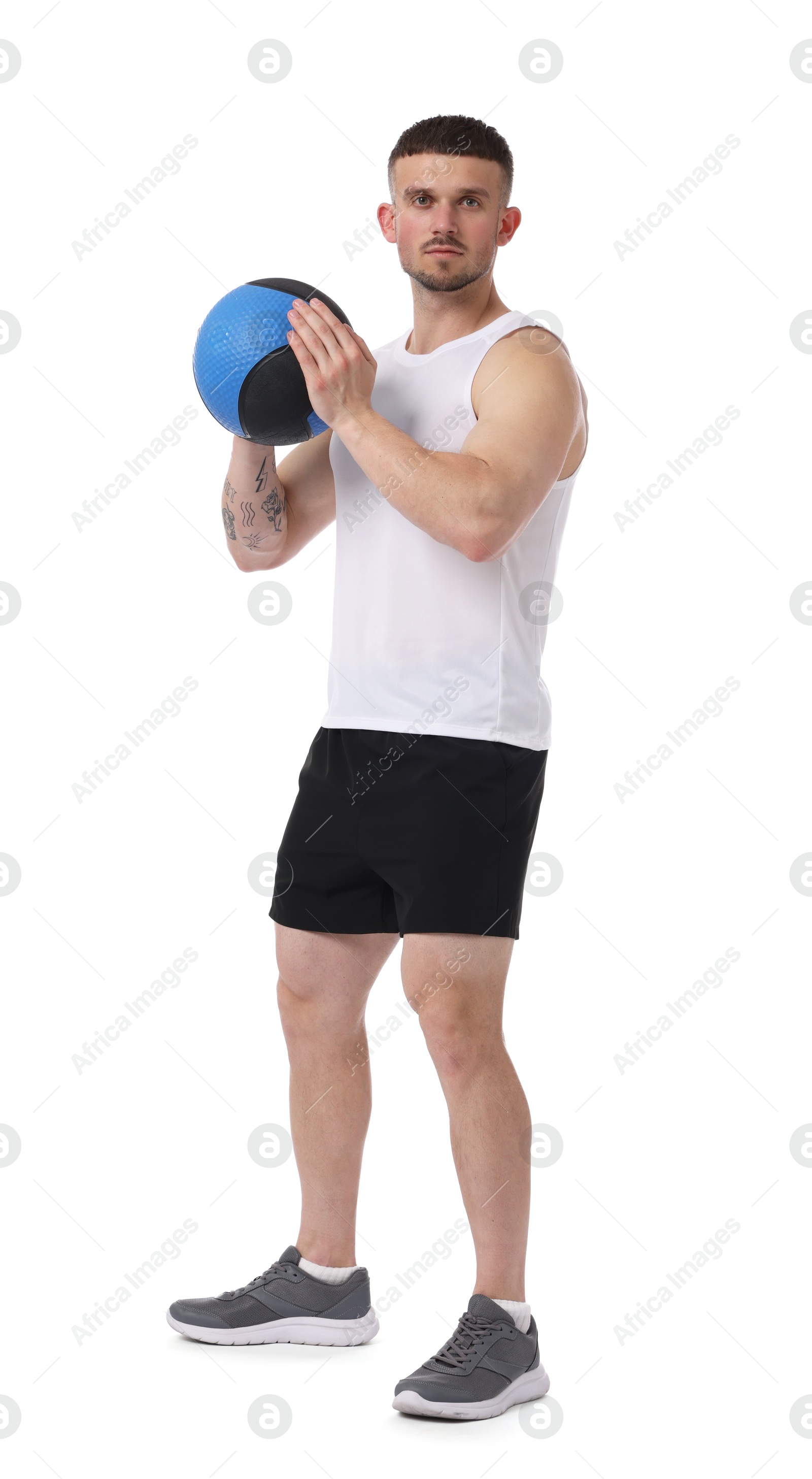 Man exercising with medicine ball on white background Photo of Man exercising with medicine ball on white background