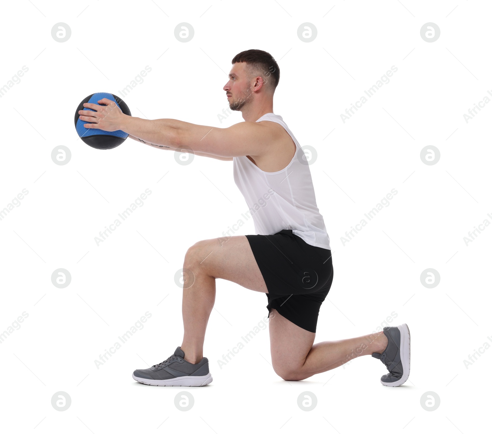 Man exercising with medicine ball on white background Photo of Man exercising with medicine ball on white background