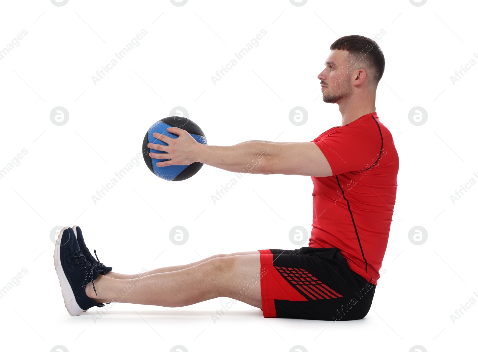 Man exercising with medicine ball on white background Photo of Man exercising with medicine ball on white background