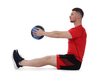 Photo of Man exercising with medicine ball on white background