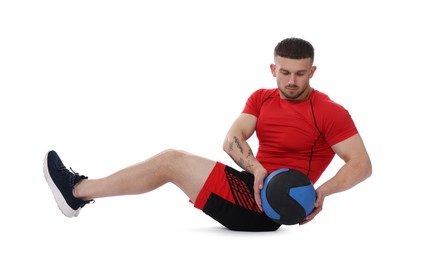Photo of Man exercising with medicine ball on white background