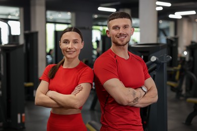 Photo of Portrait of professional personal trainers in gym
