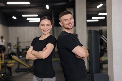 Photo of Portrait of professional personal trainers in sport center