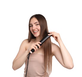 Photo of Woman straightening her beautiful hair on white background