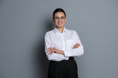 Photo of Portrait of confident business woman on grey background