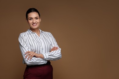 Photo of Portrait of confident business woman on brown background. Space for text