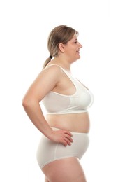 Photo of Weight loss. Plus size woman in underwear on white background
