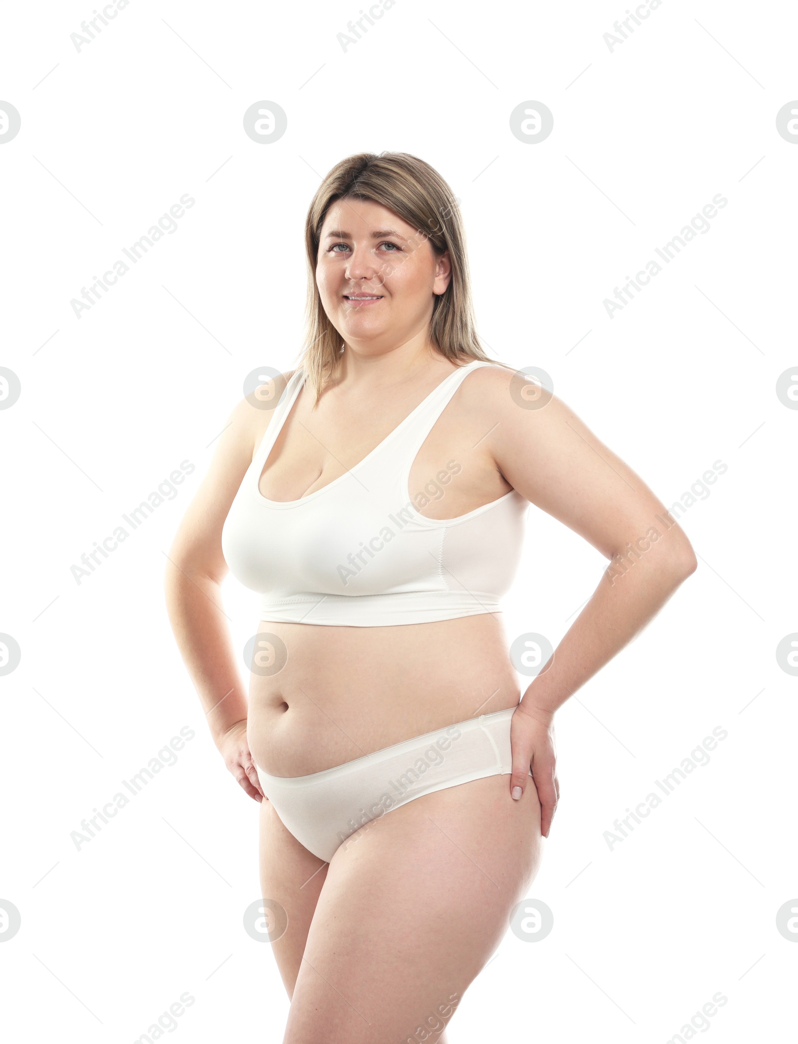 Weight loss. Plus size woman in underwear on white background Photo of Weight loss. Plus size woman in underwear on white background