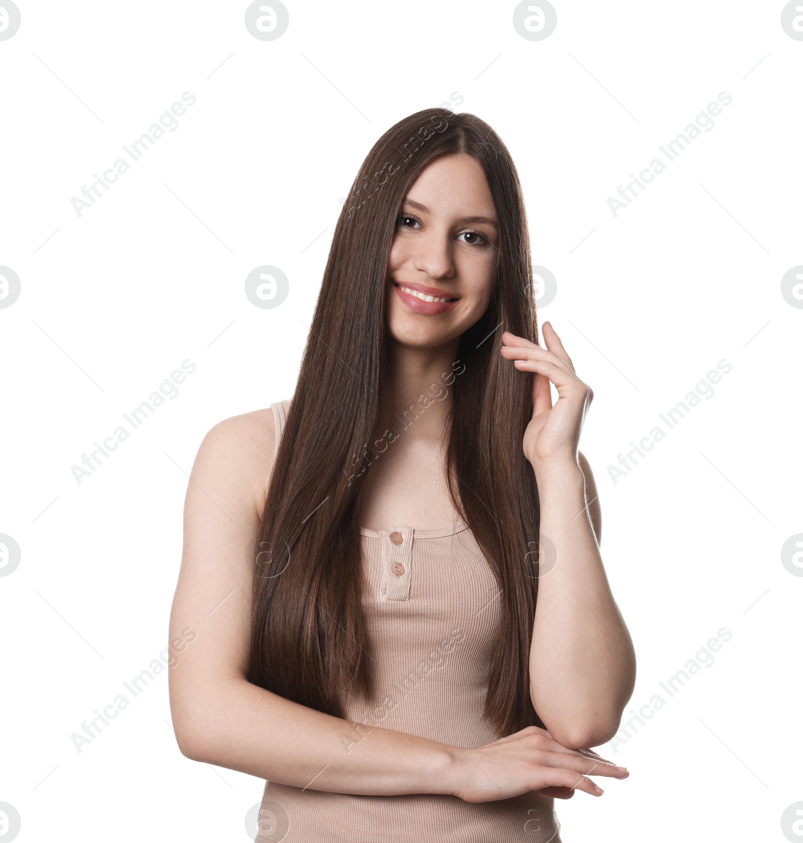 Portrait of smiling teenage girl with healthy long hair on white background Photo of Portrait of smiling teenage girl with healthy long hair on white background