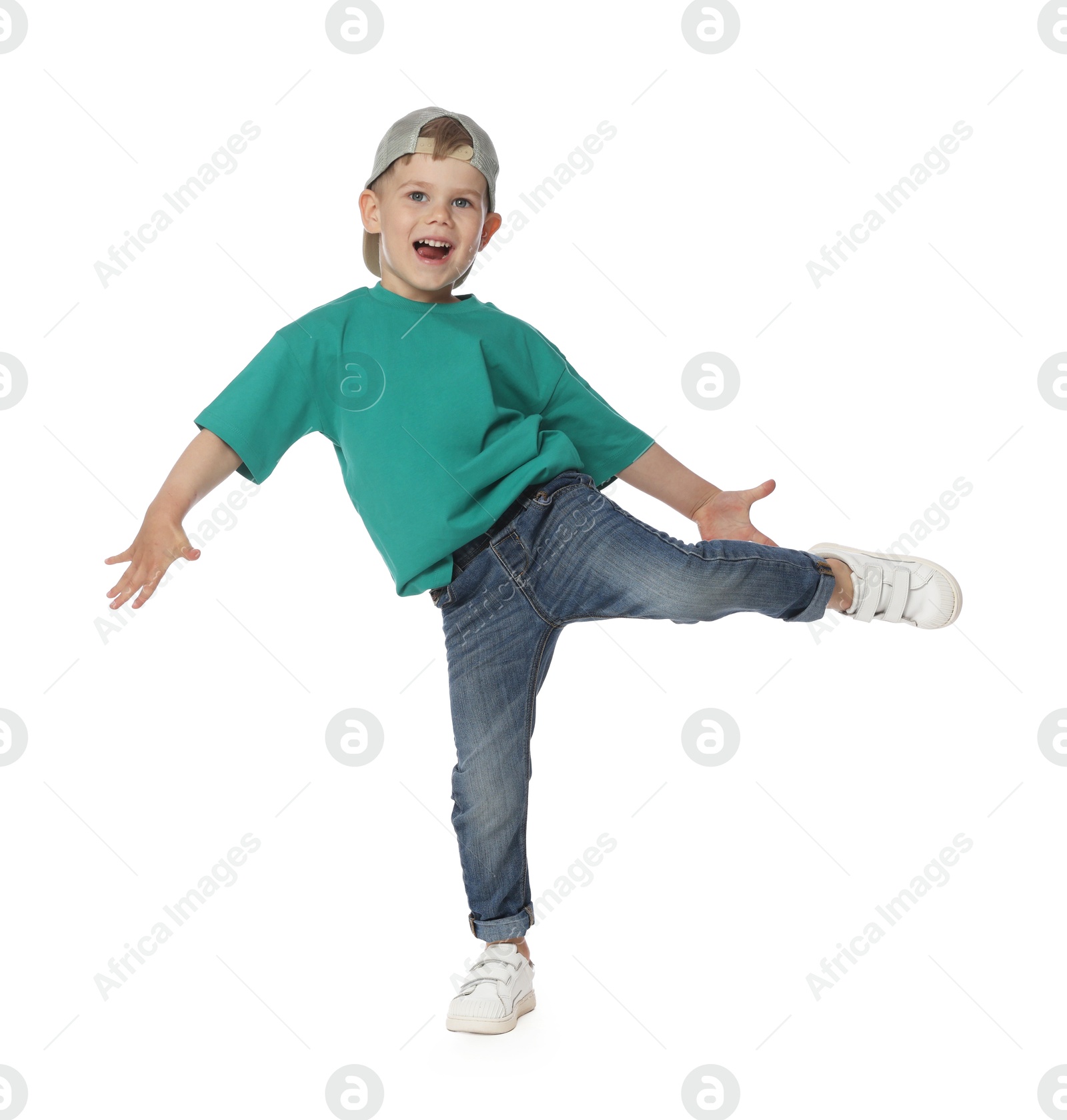 Happy little boy dancing on white background Photo of Happy little boy dancing on white background