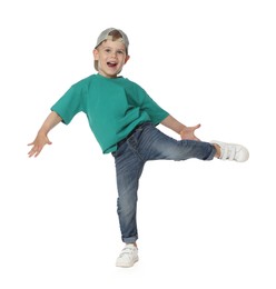 Photo of Happy little boy dancing on white background