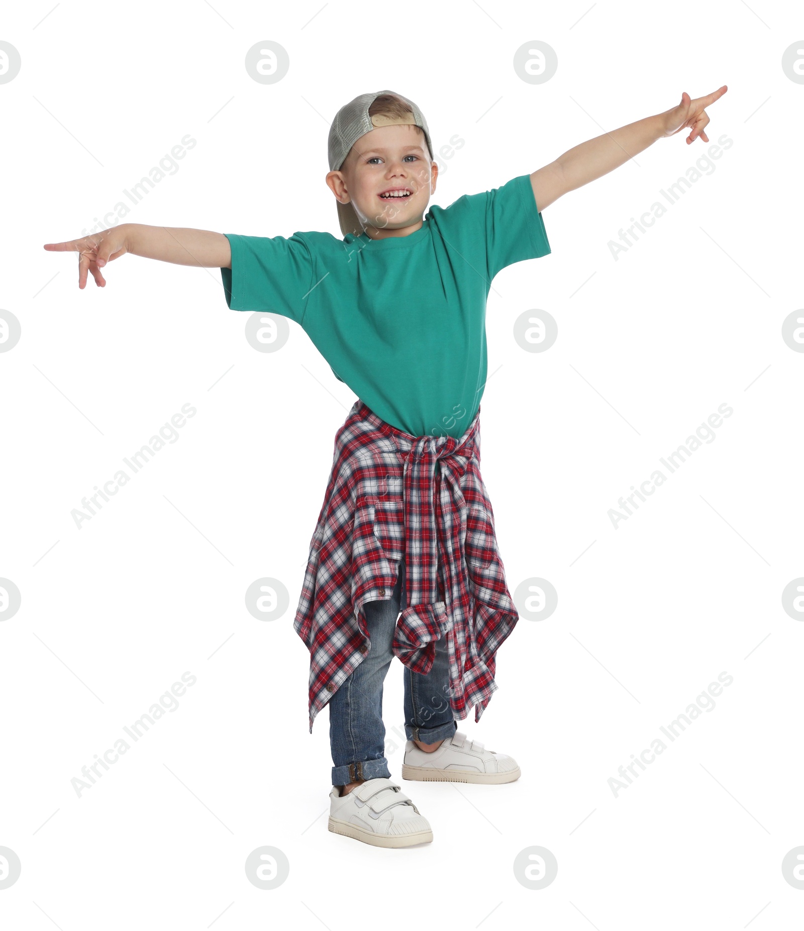 Happy little boy dancing on white background Photo of Happy little boy dancing on white background
